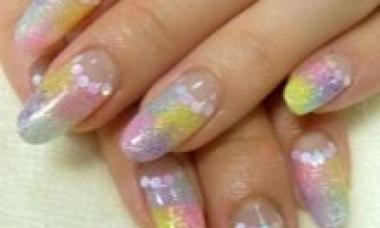 Rainbow manicure with gel polish, ombre or French